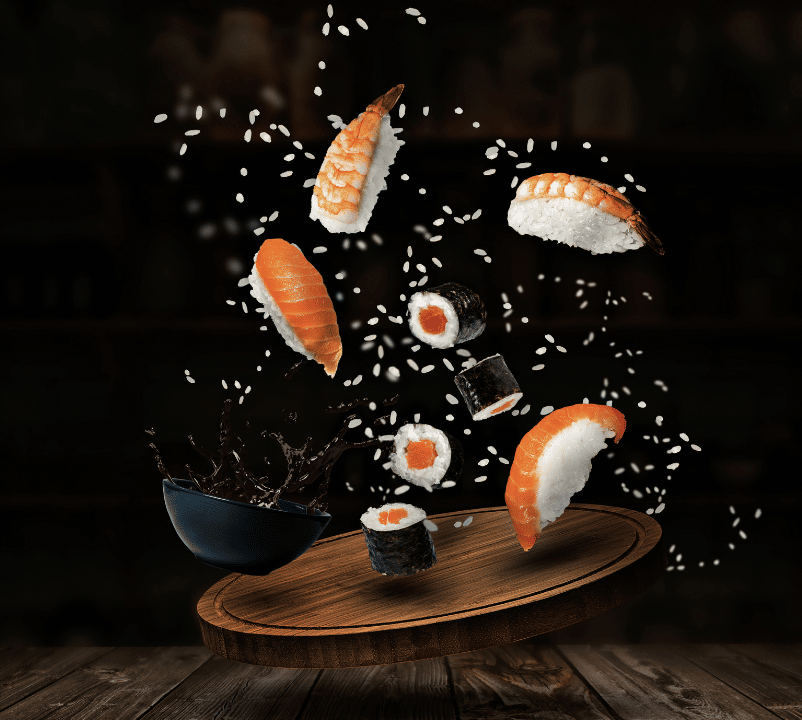 sushi tossed from wood platter