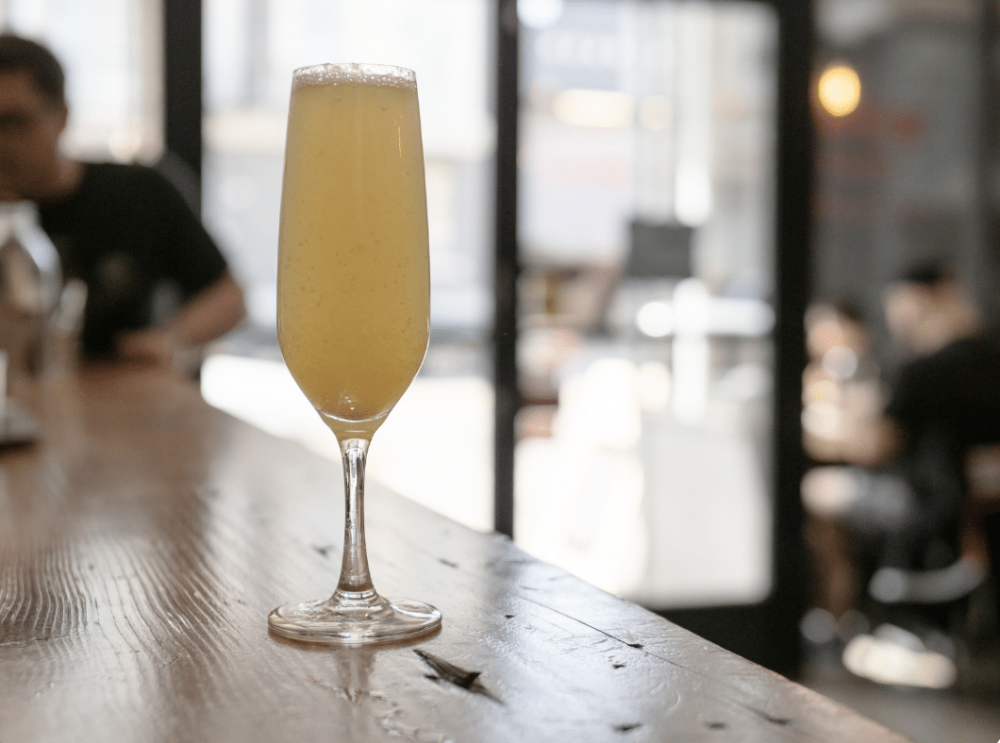 Sunday Brunch Mimosa sitting on bar